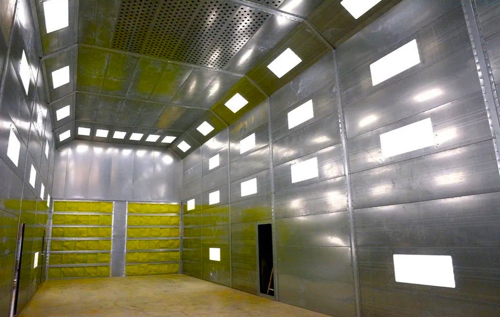 What is a spray paint booth and what is its purpose