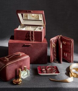 Elegant collection of luxury personalized gifts for her, including engraved jewelry and custom handbags