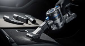 Cordless handheld vacuum with multiple attachments cleaning car interior and upholstery